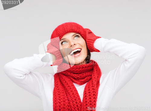 Image of smiling young woman in winter clothes