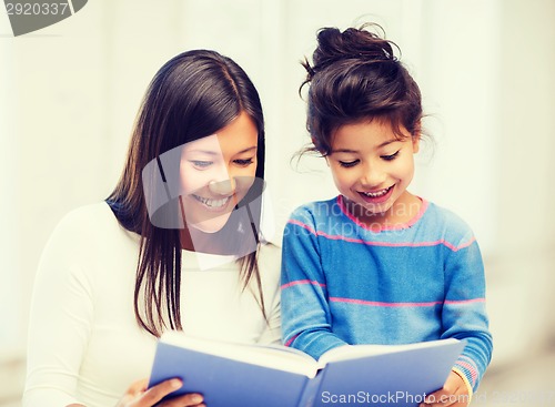 Image of mother and daughter with book