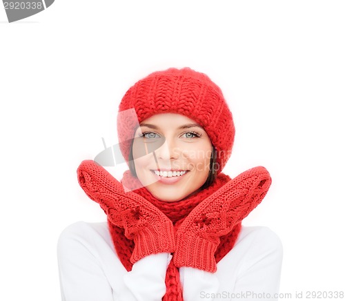 Image of smiling young woman in winter clothes