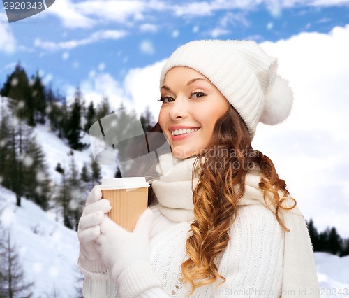 Image of woman in hat with takeaway tea or coffee cup