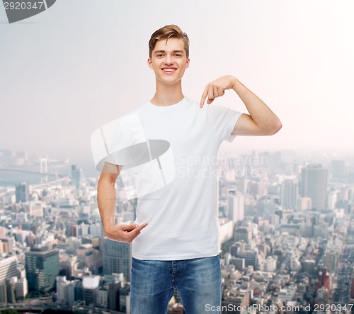 Image of smiling young man in blank white t-shirt