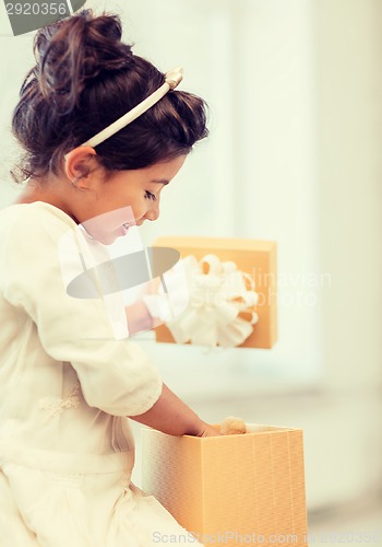 Image of happy child girl with gift box