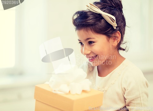 Image of happy child girl with gift box