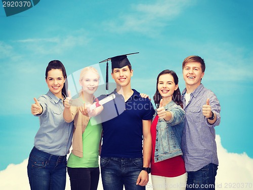 Image of group of students with diploma showing thumbs up