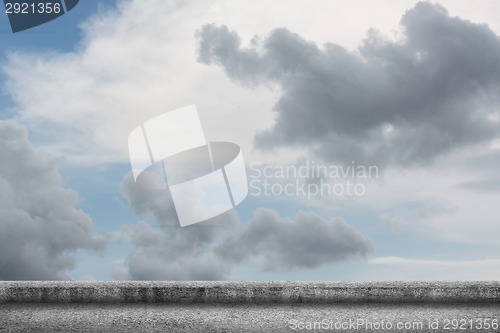 Image of concrete ground with cloudy sky