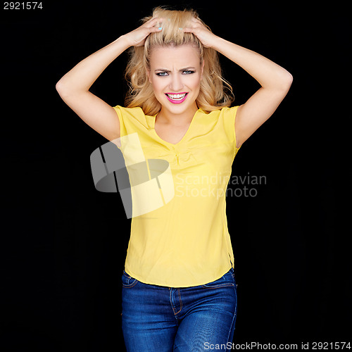 Image of Frustrated angry young blond woman