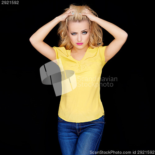 Image of Frustrated angry young blond woman