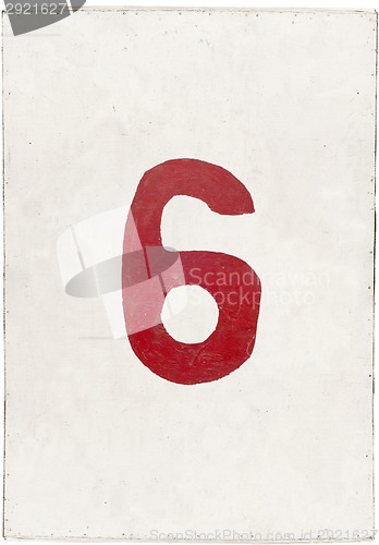 Image of number six on white plywood board 