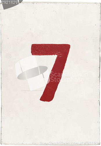 Image of number seven on white plywood board 