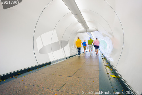 Image of People go through underpass. Abstract photo from the center of S