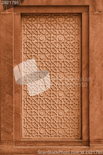 Image of Decorative stone panel on the wall on facade of the building. In