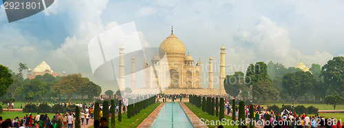 Image of Famous Taj Mahal, visited by thousands of tourists every day. Ar