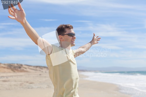 Image of young man at the beach