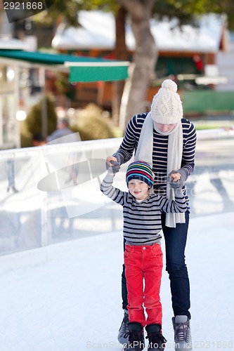 Image of family ice skating