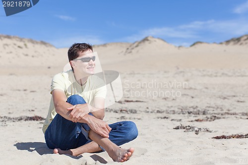 Image of young man at the beach