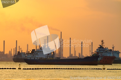 Image of Tanker ships in front of refinery.