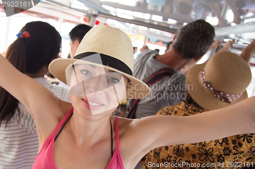 Image of Tourist traveling by public transport.