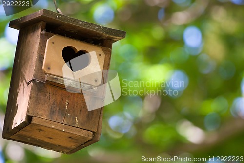 Image of Bird house with the heart shapped entrance.