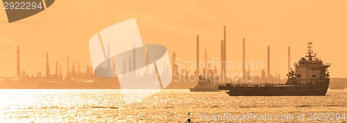 Image of Tanker ships in front of refinery.