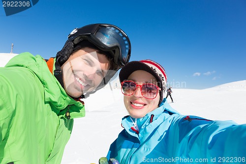 Image of Couple skiing.