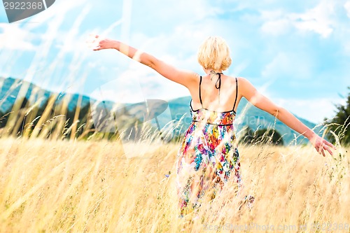 Image of Woman enjoying the nature.