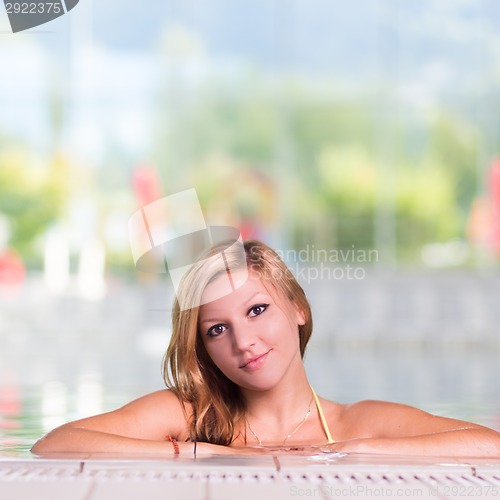 Image of Young woman in the swimming pool.