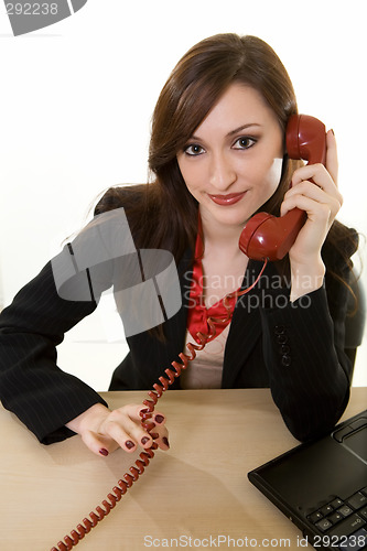 Image of Talking on an old fashioned phone