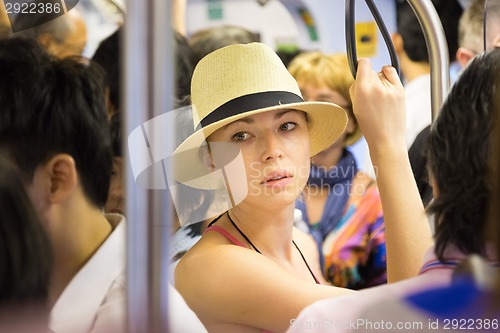 Image of Tourist traveling by public transport.