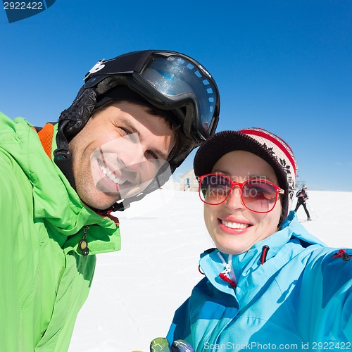 Image of Couple skiing.