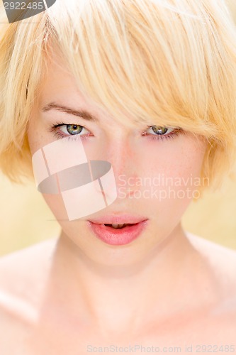 Image of A portrait of beautiful young Caucasian woman outdoor.
