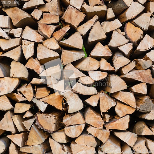 Image of Dry chopped firewood logs.