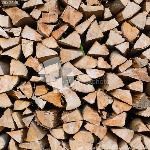 Image of Dry chopped firewood logs.