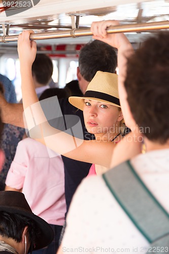 Image of Tourist traveling by public transport.