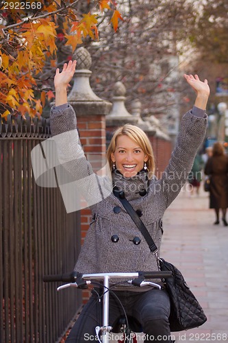 Image of Girl riding a bike.