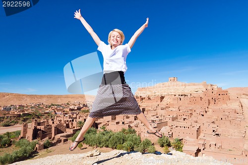 Image of Traveler jumpin in front of Ait Benhaddou, Morocco.