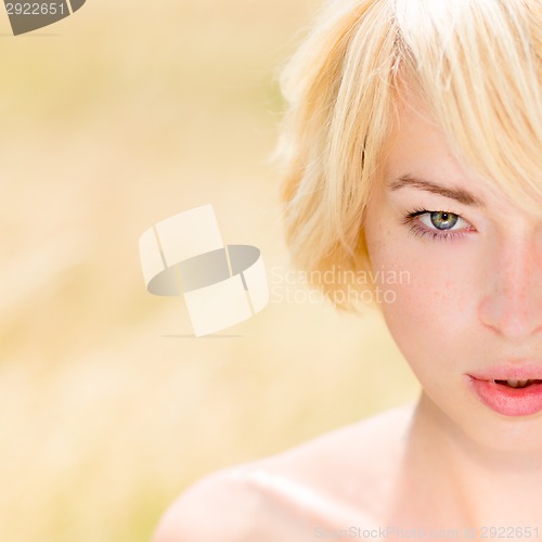 Image of A portrait of beautiful young Caucasian woman outdoor.