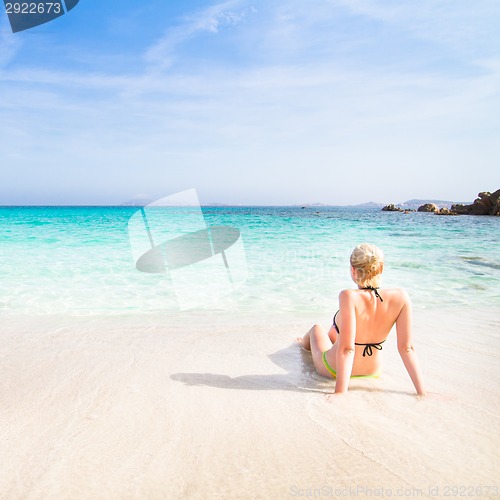 Image of woman relaxing on the beach.