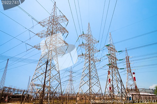 Image of High-voltage power transmission towers.