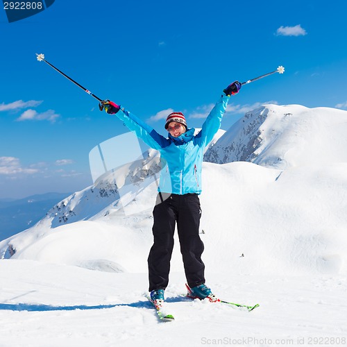 Image of Excited woman skier.