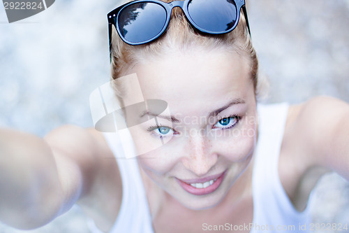 Image of Portrait of a cheerful young woman.