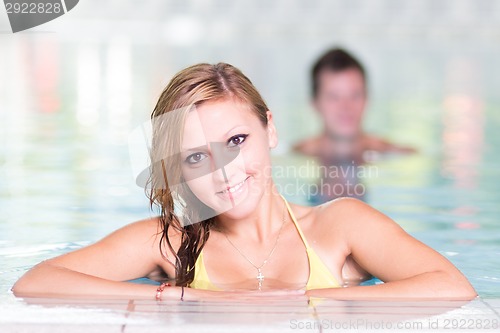 Image of Young woman in the swimming pool.