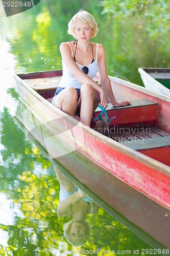 Image of Woman enjoing the sunny summer day,