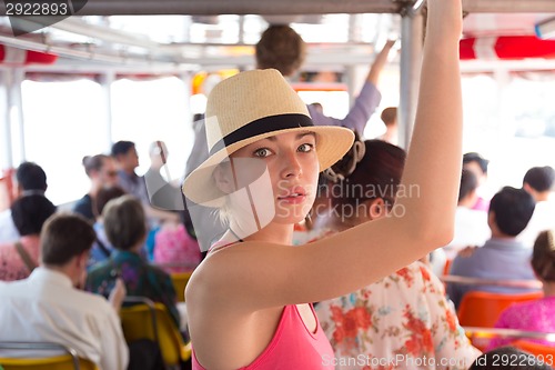 Image of Tourist traveling by public transport.
