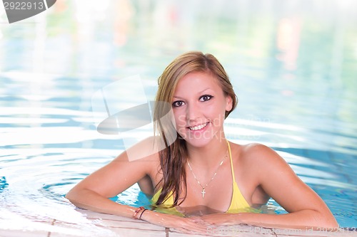 Image of Young woman in the swimming pool.