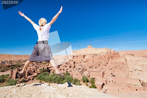 Image of Traveler jumpin in front of Ait Benhaddou, Morocco.