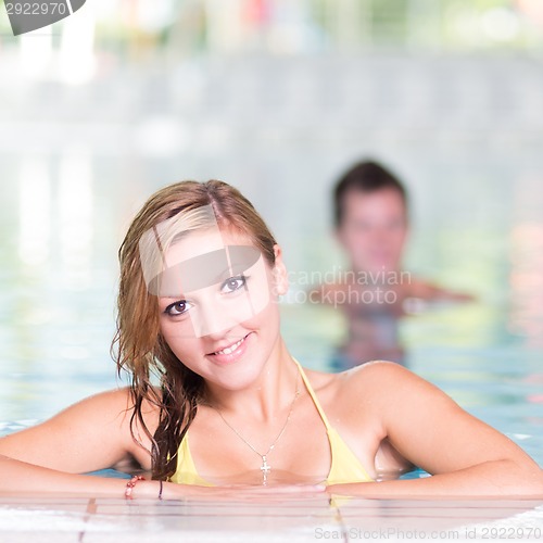 Image of Young woman in the swimming pool.