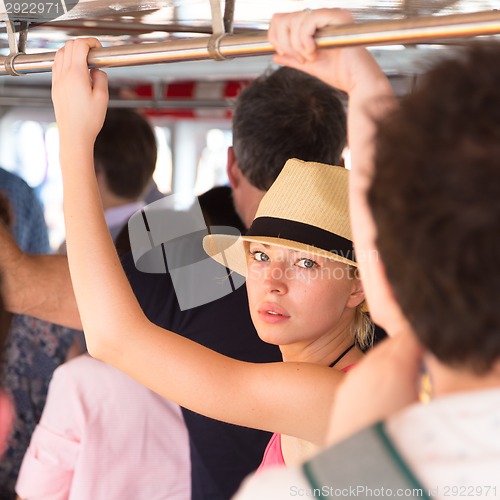 Image of Tourist traveling by public transport.