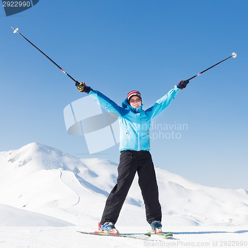 Image of Excited woman skier.