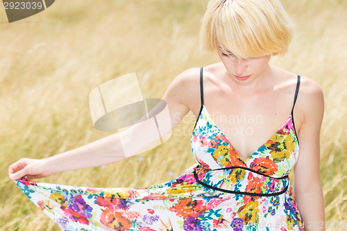 Image of A portrait of beautiful young Caucasian woman outdoor.