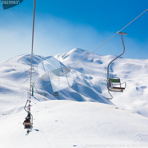 Image of Skiers on ski lift at Vogel, Slovenia.